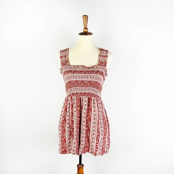 American Eagle Outfitters Pants - American Eagle pink ditsy floral smocked romper Size Medium